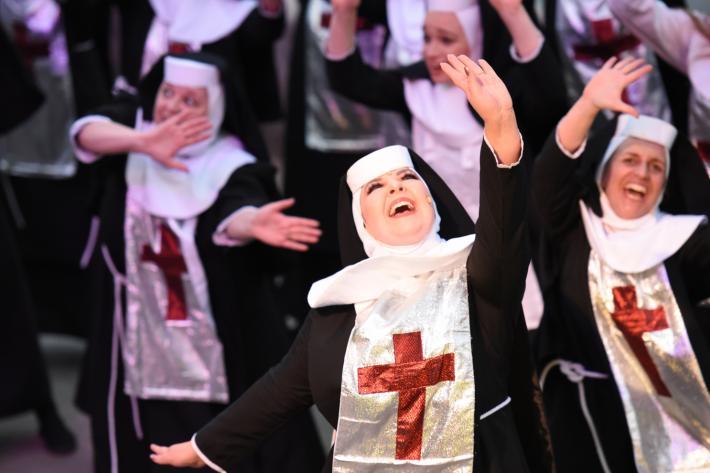 Wildly dancing nuns in sparkly habits