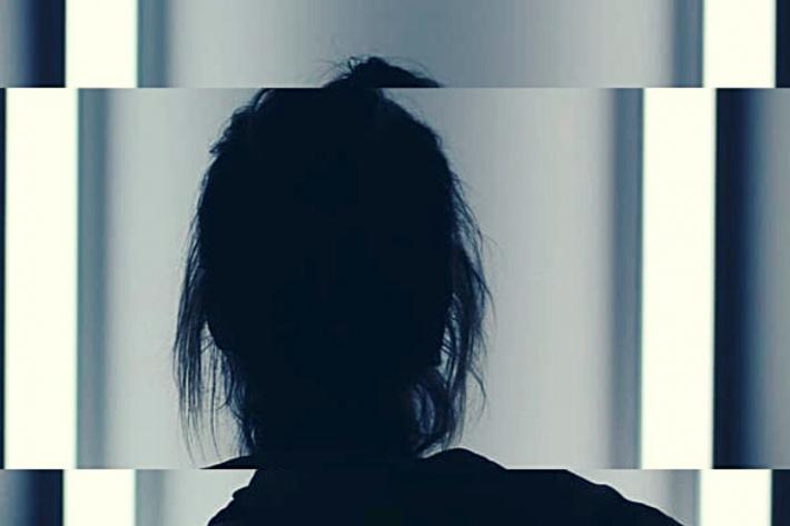 Silhouette of a woman slightly distorted