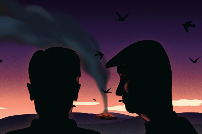 Brooding image of two men watching a burning pyre