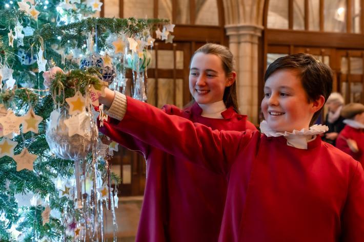 Truro Cathedral Choir members with Christmas Tree