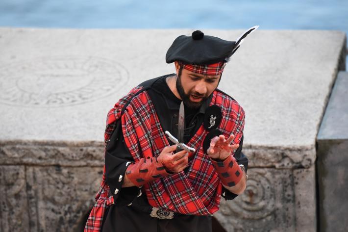 Macbeth with bloodstained hands and a dagger
